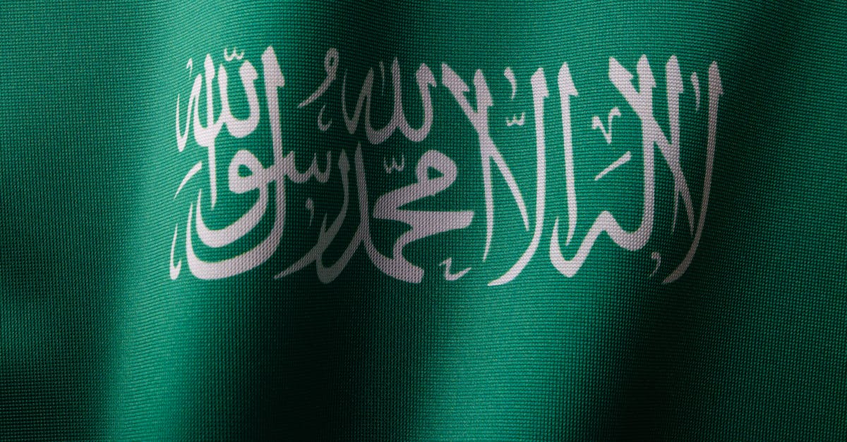 detailed close up of the saudi arabian flag showcasing the elegant arabic script and vibrant green c